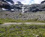 A waterfall cascading over the mountain from Train Glacier